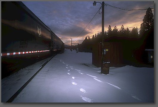 Northbound train leaves the south siding at sunset