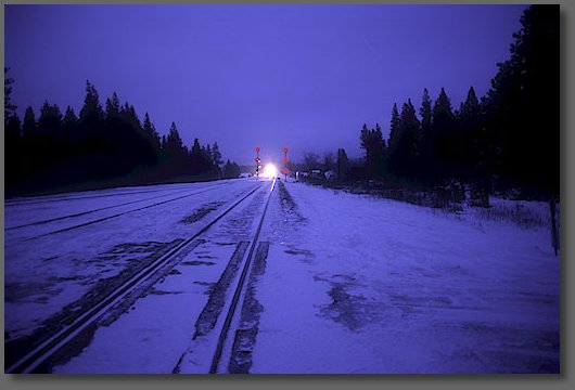 Southbound train approaching the road crossing