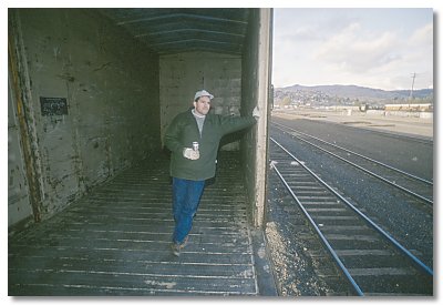 Gerry in boxcar in the Klamath yard