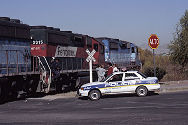 Waiting for police to investigate after the train hit a car in a crossing in Chihuahua
