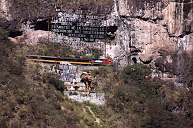 First class eastbound climbing out of Temoris past ChePe monument